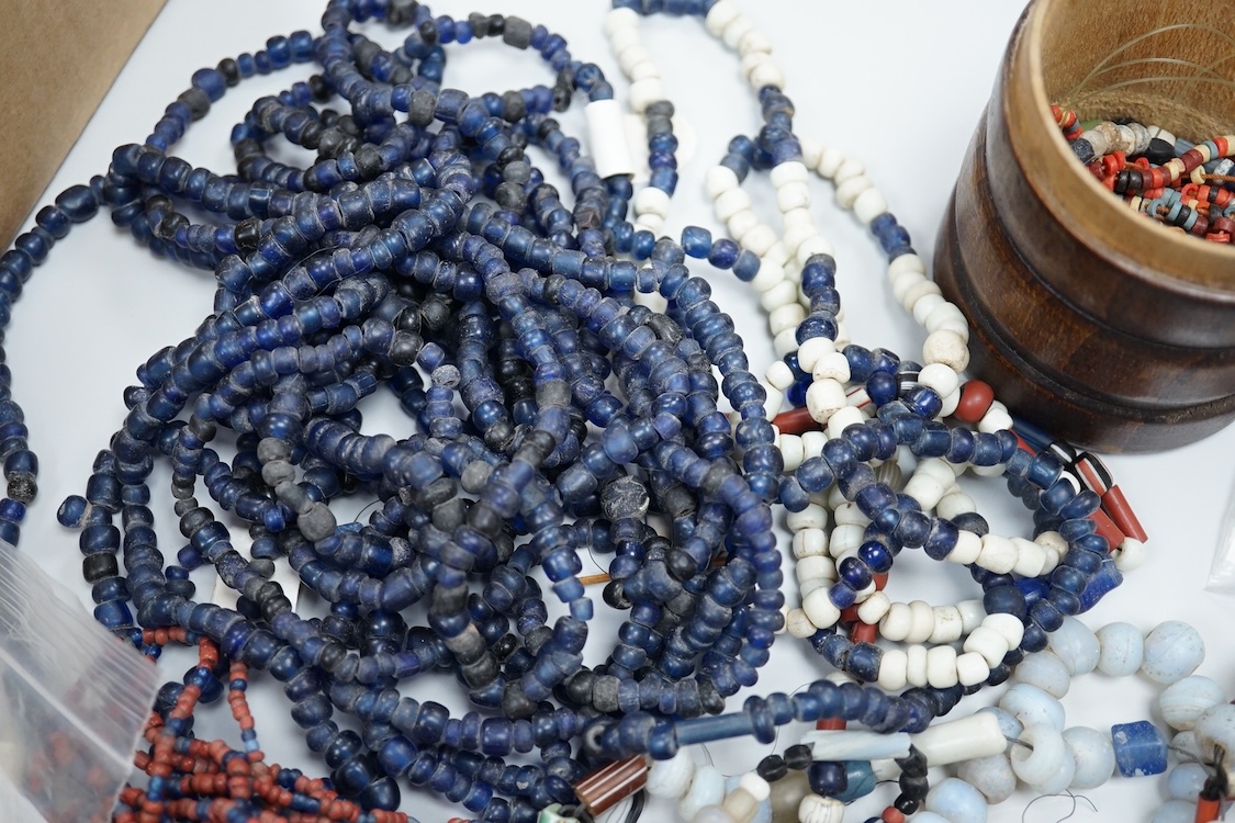 A pair of Turkish bath shoes, a collection of African beads and Middle Eastern vessels etc.